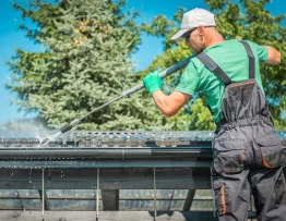 Should I use a pressure washer to clean my gutters?